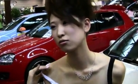 Sexy slender Japanese model flashes her cleavage in public