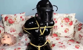 restrained-japanese-slave-in-latex-enjoys-intense-pleasure