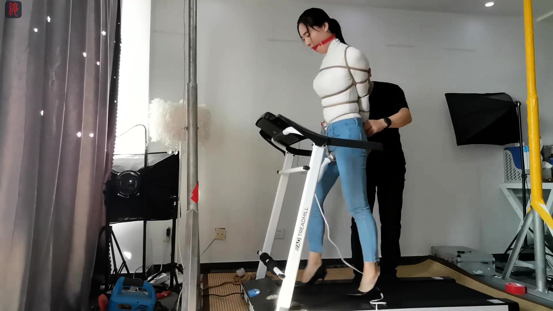 Bound And Gagged Asian Babe Walks On Treadmill In High Heels Video  